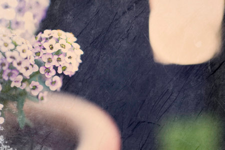 beauty delicate small flowers in a pot standing in the gardenの写真素材