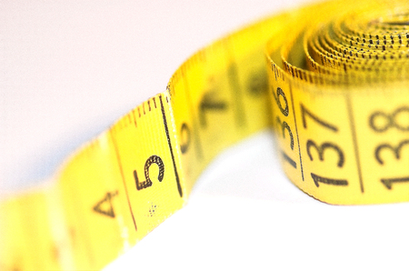 beautiful yellow old tailor scoop on white isolated backgroundの写真素材