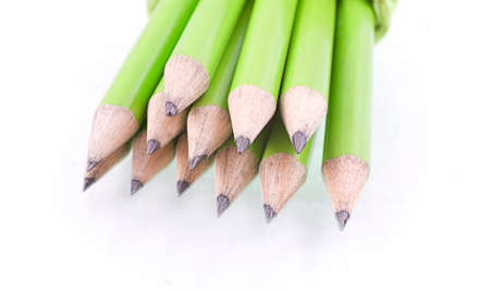 small green prepared pencils on white isolated backgroundの写真素材