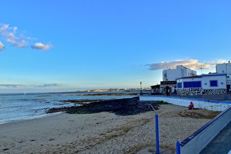beautiful landscape with the city and the ocean on a warm day, on the Spanish Canary Island Fuerteventuraの写真素材