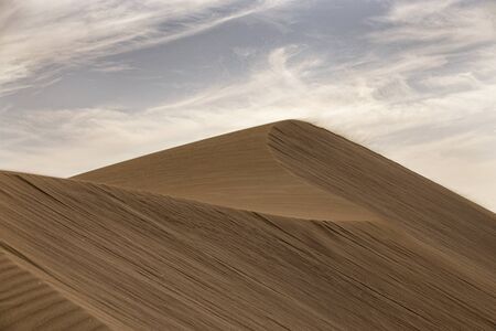beautiful summer desert landscape on a warm sunny day from Maspalomas dunes on the Spanish island of Gran Canariaの写真素材