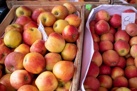 juicy apples on a market stall forming a background