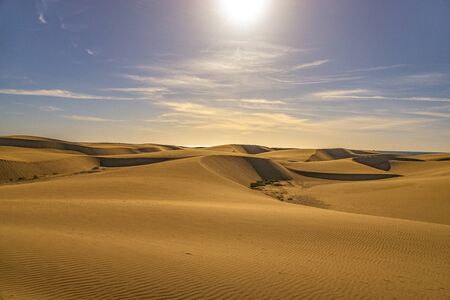 beautiful summer desert landscape on a warm sunny day from Maspalomas dunes on the Spanish island of Gran Canariaの写真素材