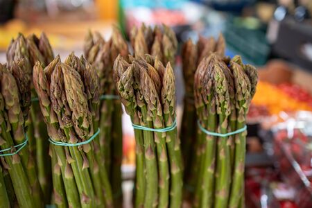 beautiful green asparagus on the market stall in close-upの写真素材