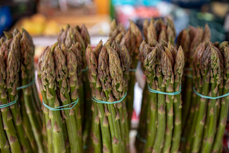 beautiful green asparagus on the market stall in close-upの写真素材