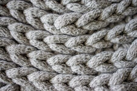 beautiful interesting background made of crochet hand-made, gray cotton cord