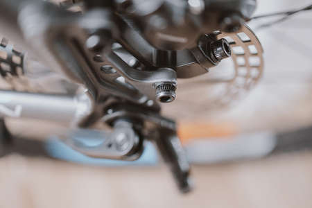black gear wheel with bicycle chain closeupの写真素材