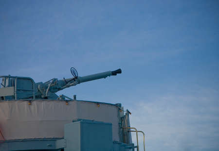 large anti-aircraft gun on a warship against the skyの写真素材