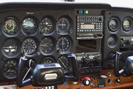 analog clocks in the cockpit of a small planeの写真素材