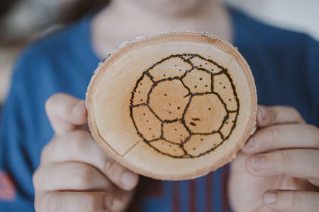 beautiful handmade wood pad with burned out soccer ball