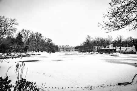 beautiful historic palace on the water in Åazienki KrÃ³lewskie park in Warsaw, Poland during snowy winterのeditorial素材