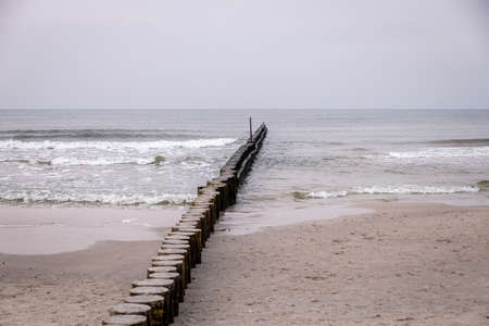 beautiful seaside landscape of the baltic sea on a calm day with a wooden breakwater