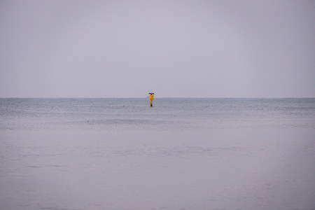 beautiful landscape by the baltic sea on a calm gray cold day in Polandの写真素材