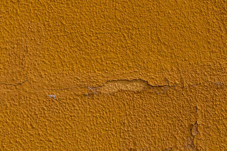 beautiful background of old colorful wall with cracked plaster in close-upの写真素材