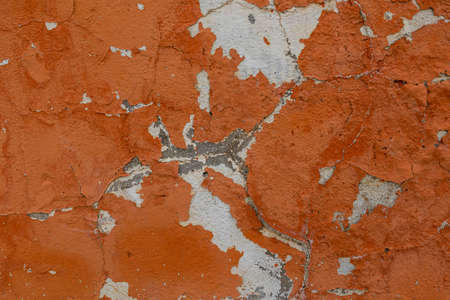 beautiful background of old colorful wall with cracked plaster in close-upの写真素材