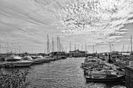 beautiful landscape with harbor and yachts on the spanish canary island of fuerteventura on a sunny dayのeditorial素材