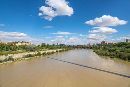 beautiful summer landscape on a sunny day view of the Ebro river and bridges in Zaragoza, Spainの写真素材