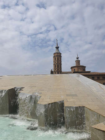 beautiful fountain in the old town of Zaragoza against a blue sky backgroundの写真素材