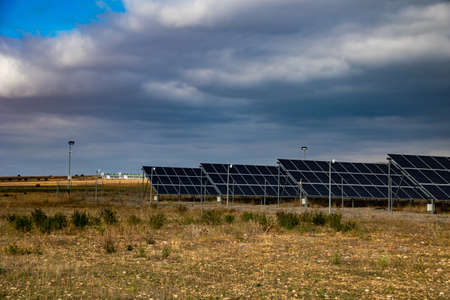 landscape with ecological solar panels outside the city on a cloudy day