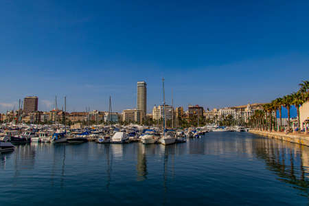beautiful seaside landscape with yacht port in Alicante Spain on a summer warm sunny dayの写真素材
