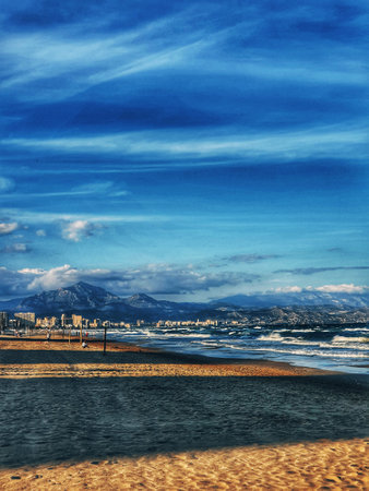 beautiful calm seaside landscape of san juan beach in alicante spain on a sunny dayの写真素材
