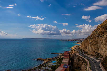 beautiful seaside landscape of alicante spain with sea and skyscrapers on a sunny day