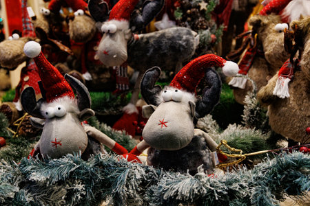 beautiful plush christmas elves in red hats backgroundの写真素材