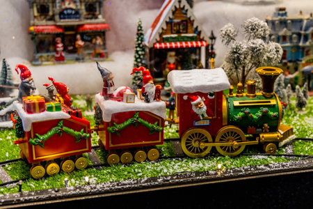 beautiful christmas decoration toy green santa's train with elvesの写真素材