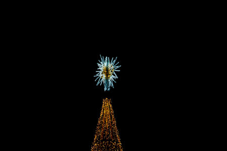 beautiful golden luminous christmas tree decoration on black background Alicante Spainの写真素材