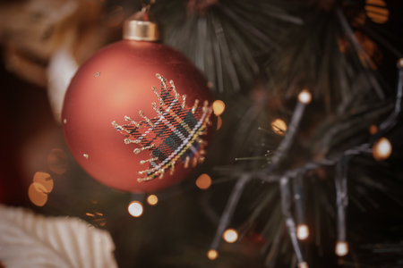 beautiful christmas bauble on a festive backgroundの写真素材