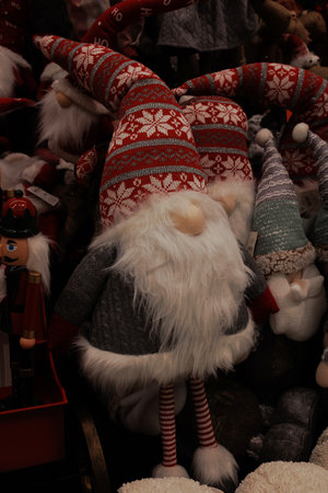 beautiful plush christmas elves in red hats backgroundの写真素材
