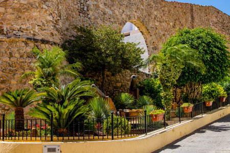 beautiful narrow streets of the old town in Calpe Spain on a summer hot holiday dayの写真素材