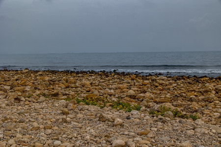 beautiful landscape empty rocky beach on a cloudy day spain