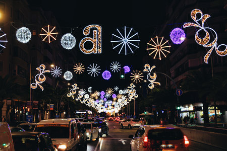 colorful Christmas decorations on the streets of Alicante, Spain at nightの写真素材