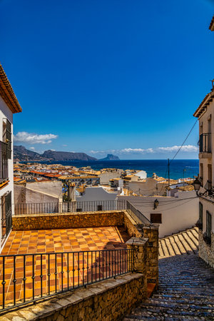 beautiful urban narrow street in the Spanish city of Altea on a summer dayの写真素材