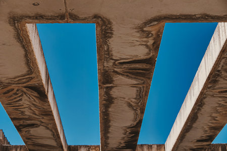 beautiful background with concrete beams against the blue skyの写真素材