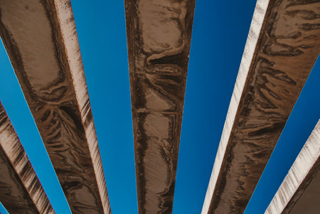beautiful background with concrete beams against the blue skyの写真素材