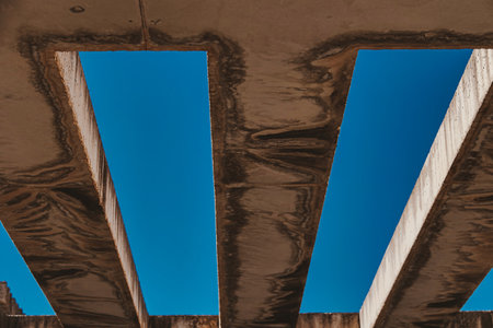 beautiful background with concrete beams against the blue skyの写真素材