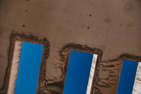 beautiful background with concrete beams against the blue sky