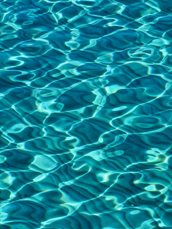 beautiful natural blue background with clear sea water at the shore