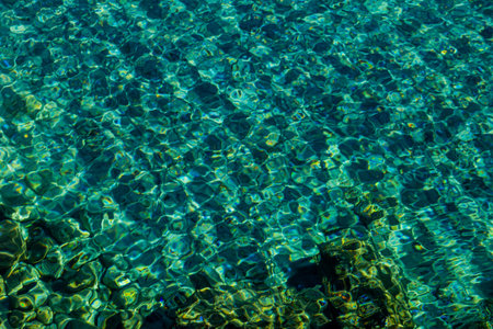 beautiful natural blue background with clear sea water at the shore