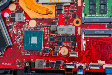 A close up view showcases a motherboard with intricate circuit patterns, RAM modules, and various electronic componentsの写真素材
