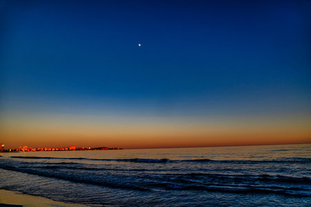 beautiful playa del postiguet alicante spain after sunsetの写真素材