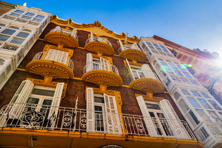 A grand historic building is centered within a lively square in Cartagena.の写真素材