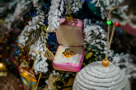 A sparkling engagement ring is nestled in an open pink velvet box
