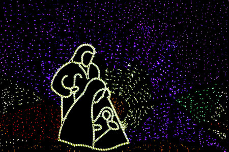 A glowing native scene is depicted with bright lights against a dark, starry backgroundの写真素材