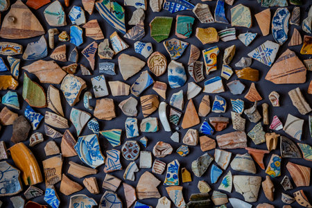 A vibrant mosaic composed of colorful ceramic fragments creating an intricate pattern.の写真素材