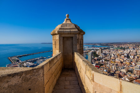 Overlooking a vibrant city, the ancient castle provides a stunning view of the coastline and marina.の写真素材