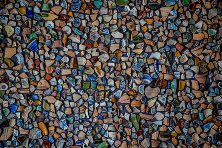 A vibrant mosaic composed of colorful ceramic fragments creating an intricate pattern.の写真素材