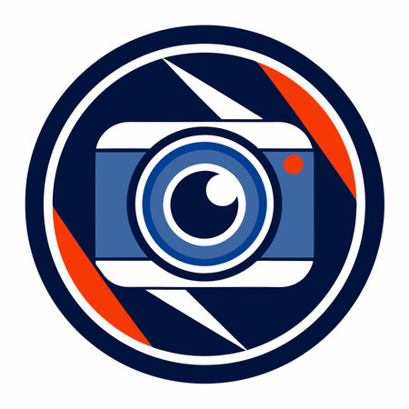 A stylized camera lens is centrally positioned within a circular frame, featuring bold blue, white, and red elementsの素材